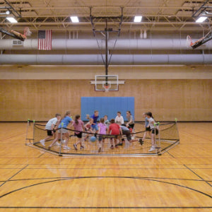 Kids playing Gaga Ball - Froggy Ball in a school gym