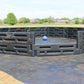 Outdoor gaga ball pit made of modular black plastic panels with a blue ball on a rubber play surface by Castle Sports.